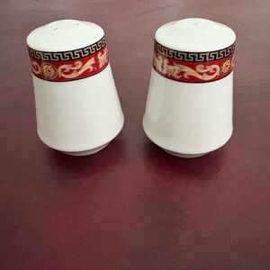 Elegant White Salt and Pepper Shakers with Red and Gold Trim